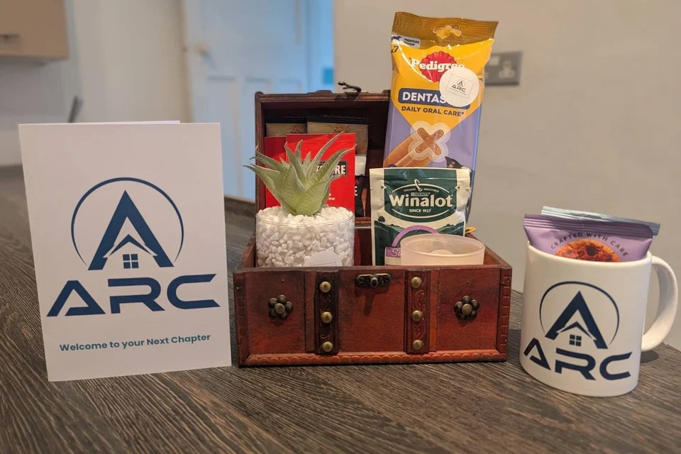 ARC welcome card, branded mug and a small move-in hamper